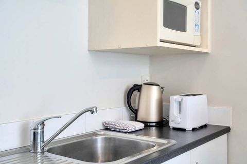 The kitchenette comes with a microwave, toaster, kettle, and fridge.