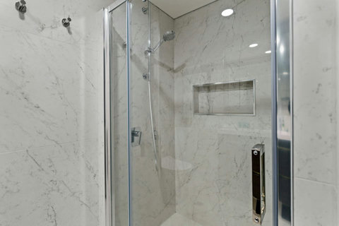 The shower is modern and there are handy pegs for your bathrobes to be hung on.