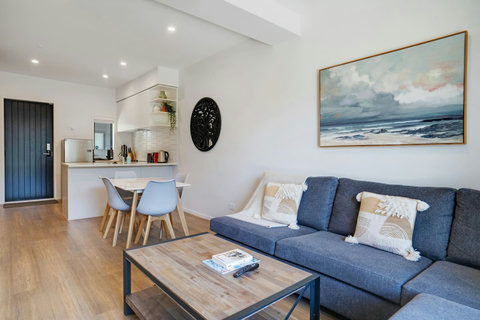 The living room is part of the open-plan floor plan with the dining space and kitchen.