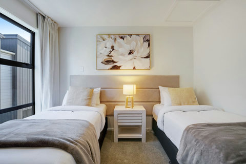 The bed is set-up as 2 x single beds, however can be converted into a King bed (as pictured with blue throw)with 48 hours prior notice.