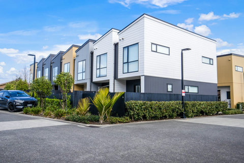 The townhouse is located amongst other similar houses.