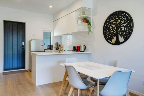 The artwork on the wall adds some interest to otherwise a blank canvas.