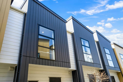 The townhouse is located amongst other similar houses.