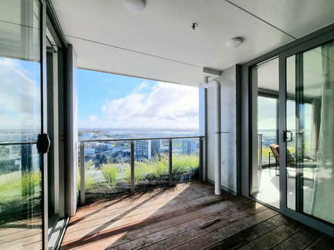 The covered balcony has plenty of space to sunbathe or hang out in a deck chair.