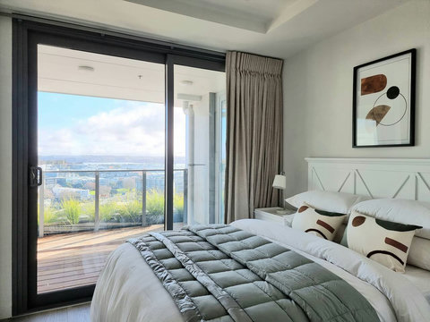 The second bedroom also shares access to the covered balcony.