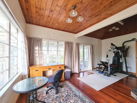 The home gym and desk area are in a separate room.