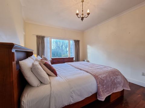 Period features like leadlight windows, chandelier and polished wooden floors are a highlight in the bedroom.