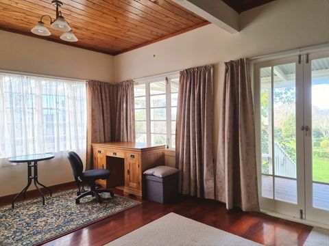 This would be a lovely place to sit and get work done with the French doors and fireplace.