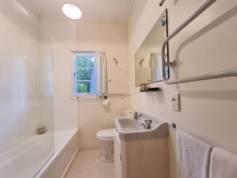 The second bathroom features a bathtub and shower combo.