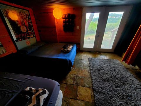 UPGRADE OPTION DEN
under patio Den only used for the 3rd & 4th persons. A bit rustic & simple accommodations vs the main cabin. An overflow room basically. Less than 10 steps from Cabin. 

Shower, Bathroom, Sink, Small Refrigerator, Spring Water. 