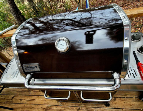 big Webber grill, older but functions as it should with grill lighter. 
