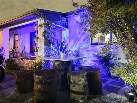 front of the house and tree outdoor table