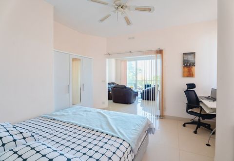 Spacious 2nd bedroom with private bathroom and convenient workspace.