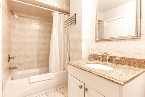 Full bathroom with tub shower combo.