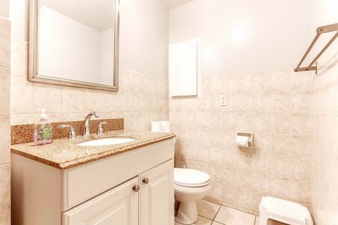 Full bathroom with tub shower combo.