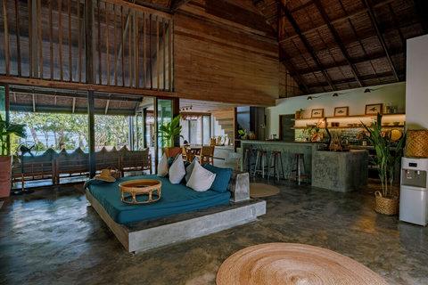 Main living area connecting the kitchen, dining, and lounge in an open-plan design