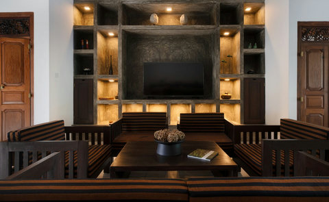 TV & Feature Wall- A stylish lounge with a stunning built-in feature wall, soft backlighting, and comfortable seating for movie nights or conversation.