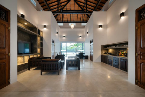 Kitchenette & Seating Area- A bright, open space with a fully equipped kitchenette, wooden furnishings, and cosy seating—perfect for relaxed, homely living.