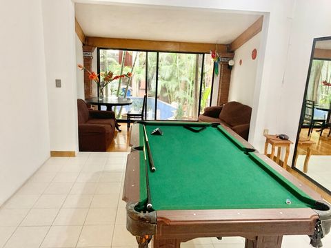 Communal lounge with a pool table outside the apartment 