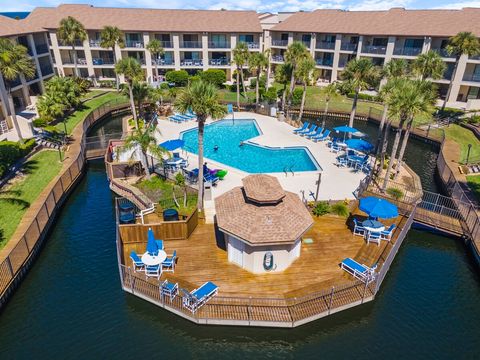 Heated pool and surrounding lagoon filled with koi.