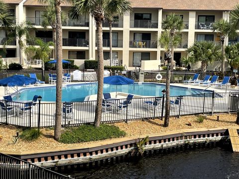 View from the balcony of the heated pool with surrounding lagoon filled with koi.