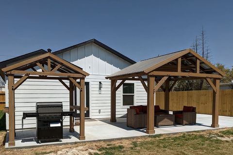 Amazing back patio set up with brand new gas grill and comfort seating.