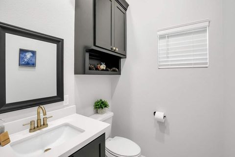Downstairs 1/2 bath with kids stepping stool and kids removable toilet seat.
