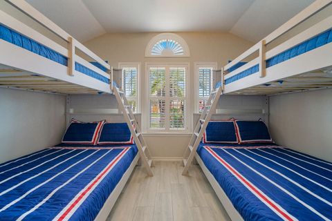 Super cute bunk room with two full beds and two twin beds.