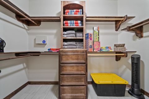Huge walk-in closet with beach towels, bath towels, board games etc.