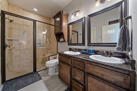 Step into the bright & charming master bathroom where you'll find a double vanity and plenty of counter & cupboard space.