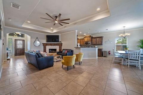 Come on in! The living area has a few cozy couches and a 65" Smart TV, making this area the perfect place to relax and unwind after a long day on the Beach.