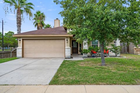 A view of the front of the home with spacious parking.