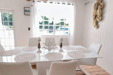 Dining Room: Bright and airy space for delightful meals, adorned with chic decor and natural light!