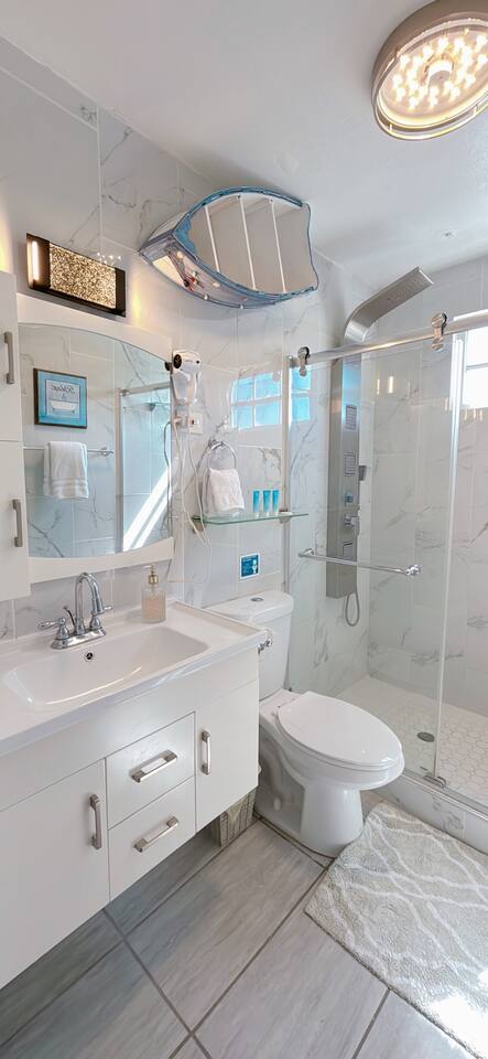 Master Bathroom: Elegant design with marble accents, sleek fixtures, and a refreshing walk-in shower!