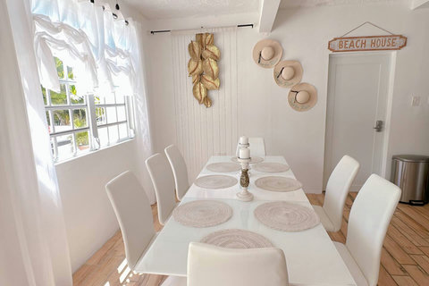 Dining Room: Bright and airy space for delightful meals, adorned with chic decor and natural light!