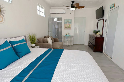 First Floor Master Bedroom: Bright and airy retreat with serene decor and plush furnishings!