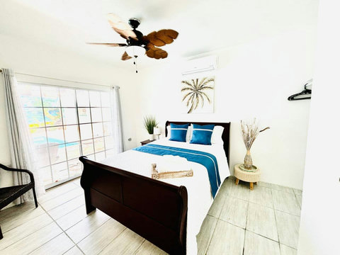 First Floor Bedroom: Bright ambiance with a serene view and stylish decor for restful nights!