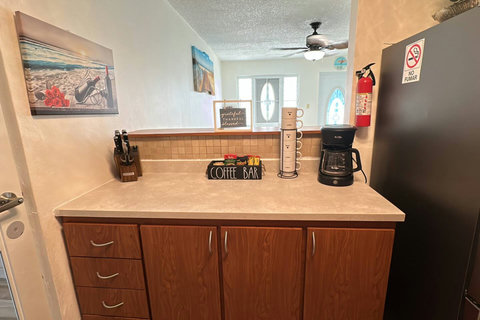 Kitchen: Whip up delicious meals in this stylish space with modern appliances and bright accents!