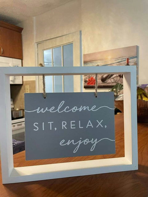Welcoming Sign: Embrace island life with our charming invitation to unwind and enjoy!