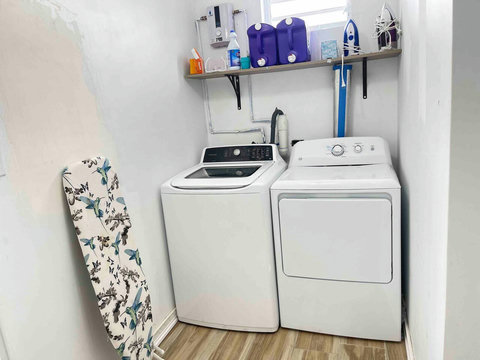 Laundry Room: Efficient space equipped with modern appliances for hassle-free laundry days!