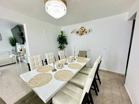 Dining Room: Elegant ambiance with chic seating and artistic decor awaits your culinary adventures!