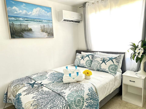 Second Bedroom: Beachy vibes with stunning decor, bright light, and refreshing ocean air!