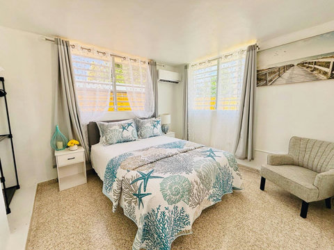 Serene Bedroom: Stylish decor and charming details invite you to unwind in paradise!