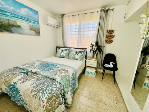 Second Bedroom: Beachy vibes with stunning decor, bright light, and refreshing ocean air!