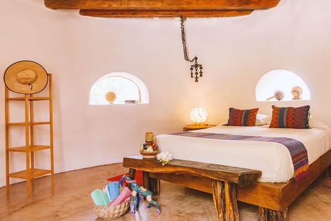 The round rooms  made of earth and wood have an immediately noticeable calming effect. Floor and walls are cool to the touch making for a very comfortable space. Simple but usable spaces to unpack and settle in.