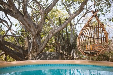 Pool has ocean view, an island and various hammocks, hanging chairs depending on the season. Its 1.5m deep, no shallow end, kids beware