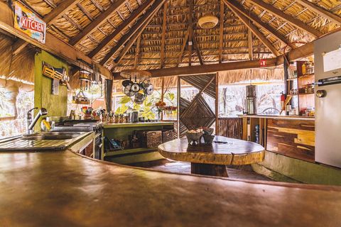 Shared kitchen among all the houses.  Mosquito screen keeps bugs out, but at the end of the day its an open air kitchen in the jungle, so cleanup after yourself and don't leave food out.