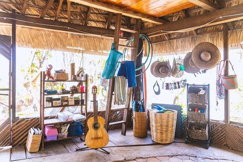 Fun Corner. This is where you can grab a hat, sunglasses, a kite, a board game, a hula hoop, a fire extinguisher, or some sunblock. Beachy things can be found here, no guarantee, things come and go and stay. I'm not gonna lie, guitar is out of tune.