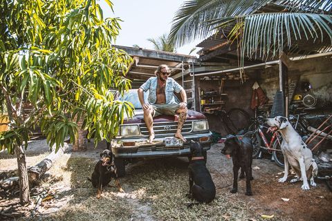 Nico your host and his dogs. The big white one of the right is no longer howling at the moon, visit his grave and pour one out for him. #RIPScooby #DEPScooby