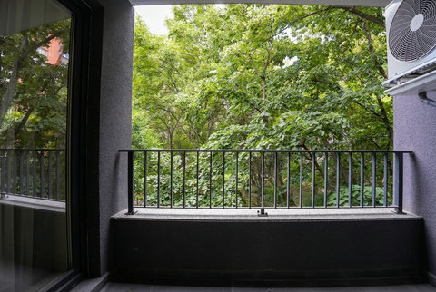Private covered balcony with tranquil leafy views